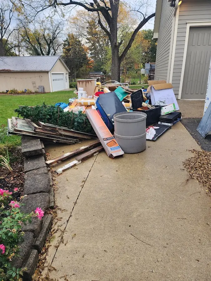 Dumpster being loaded with debris for Commercial Dumpster Rental in Paloma Creek South